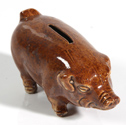 EARLY FIGURAL POTTERY PIG BANK