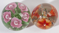 TWO FLORAL ART GLASS PAPERWEIGHTS