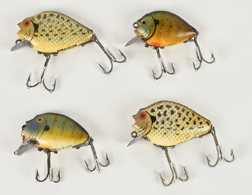 Four Heddon Punkin Seed Fishing Lures
