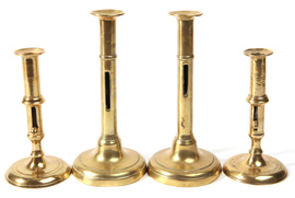 Four 19th Century Brass Push Up Candlesticks