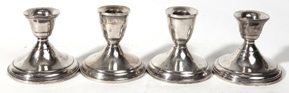 Four Sterling Candlesticks
