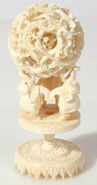 CARVED CHINESE IVORY MYSTERY BALL & STAND 